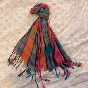 Multicolored, plaid, polyester scarf. Brand unknown.